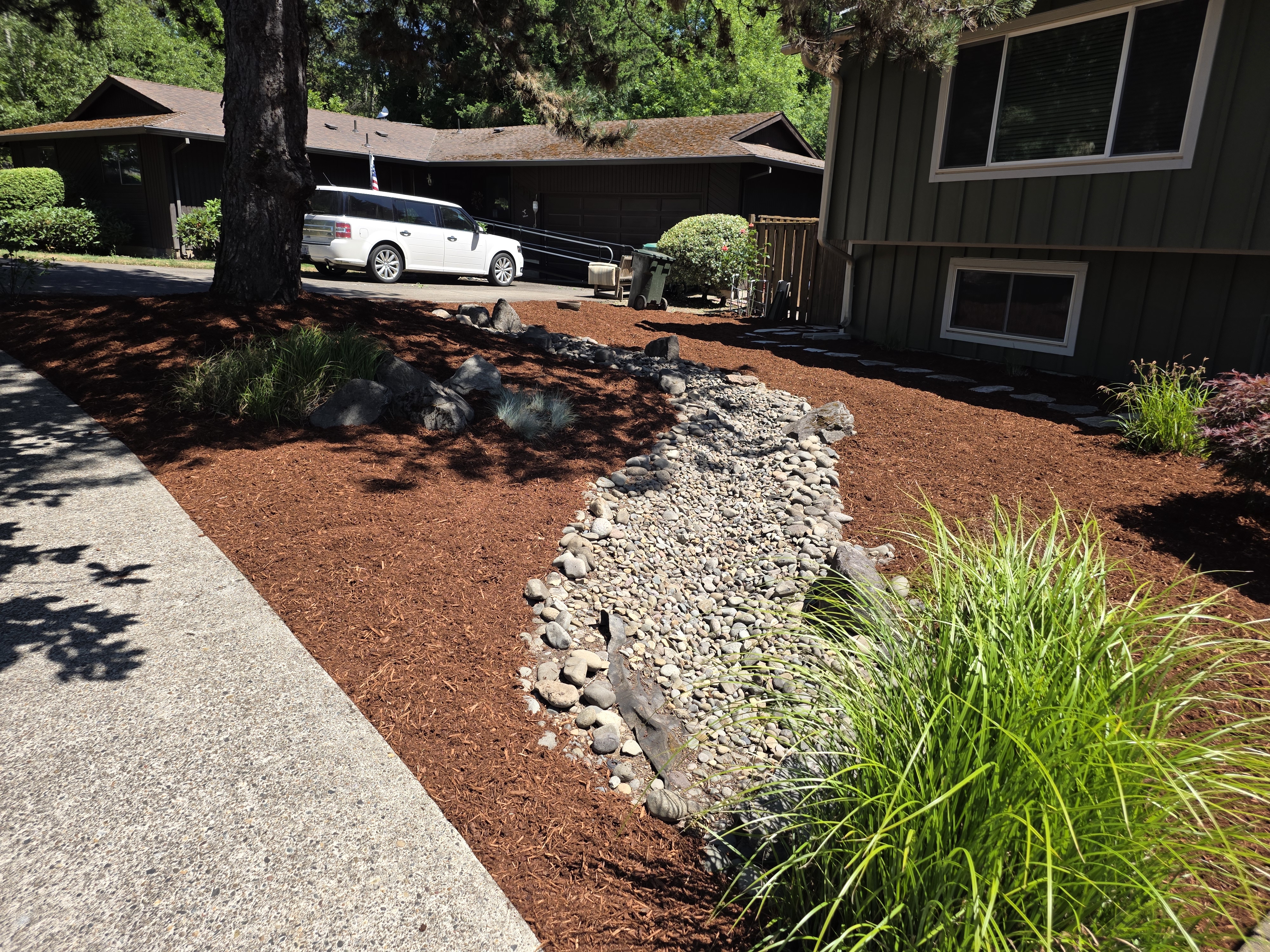 River rock dry creek landscape design